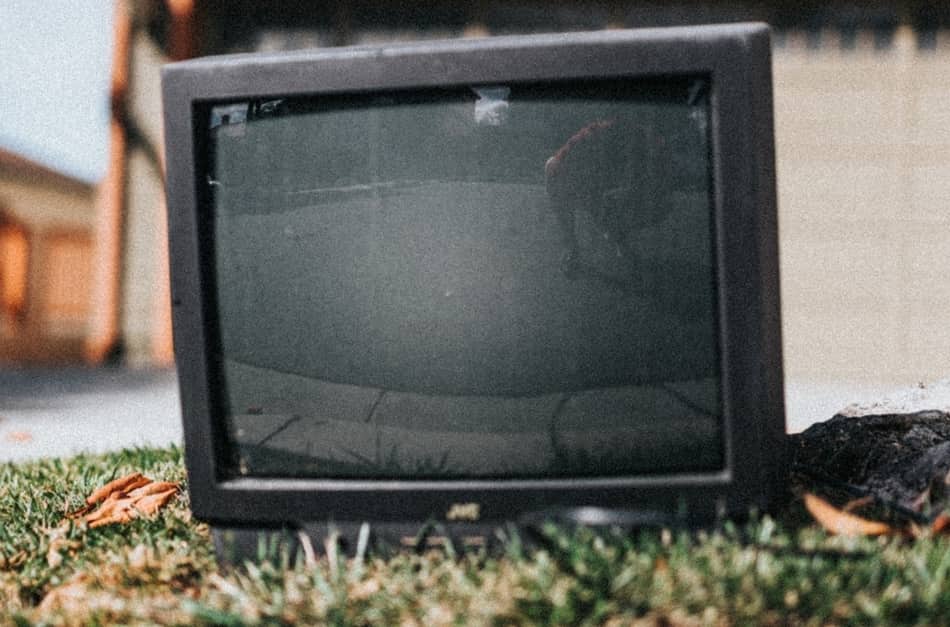 photo of TV outside on grass