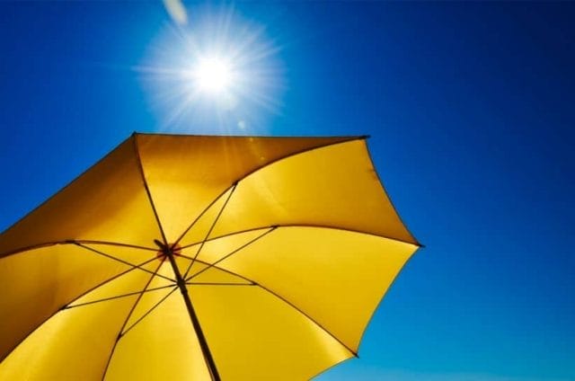 photo of umbrella and bright sun