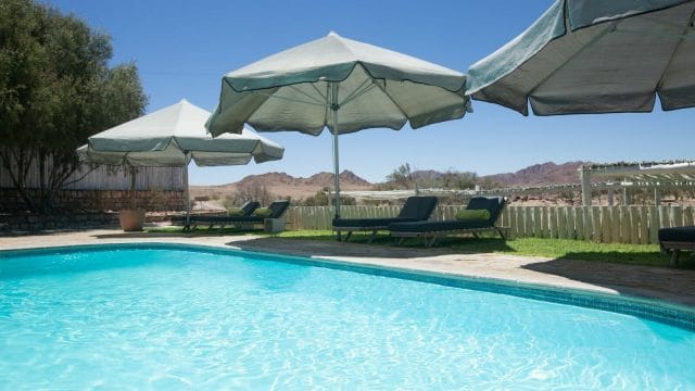 photo of umbrellas by pool
