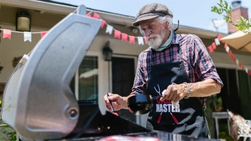 photo of older person grilling
