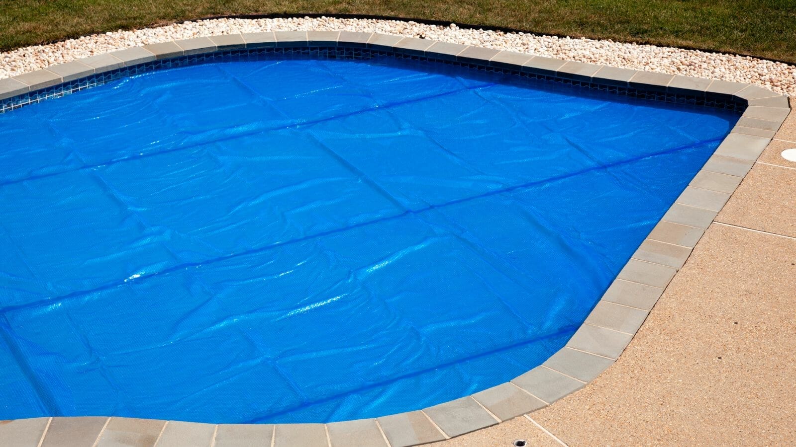 photo of pool cover touching water